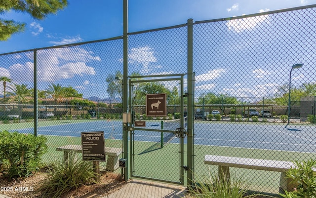 9450 E Becker Ln Unit 1102, Scottsdale, AZ 85260 - view of tennis court with fence and a gate