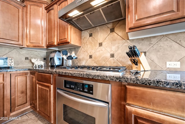 2565 N 141st Ln, Goodyear, AZ 85395 - kitchen featuring custom range hood, stainless steel appliances, tasteful backsplash, and tile countertops