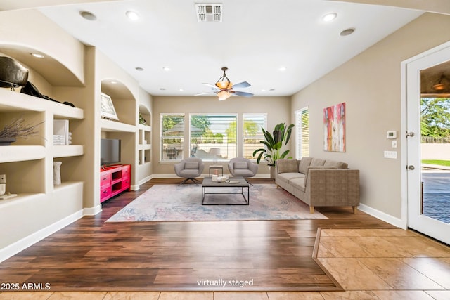 2565 N 141st Ln, Goodyear, AZ 85395 - living room featuring wood finished floors, a ceiling fan, built in shelves, baseboards, and recessed lighting