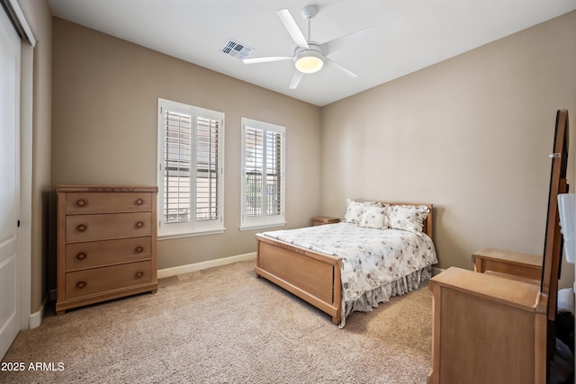 2565 N 141st Ln, Goodyear, AZ 85395 - bedroom with carpet floors, baseboards, ceiling fan, and a closet
