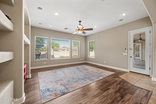 2565 N 141st Ln, Goodyear, AZ 85395 - living room featuring a ceiling fan, plenty of natural light, wood finished floors, and recessed lighting