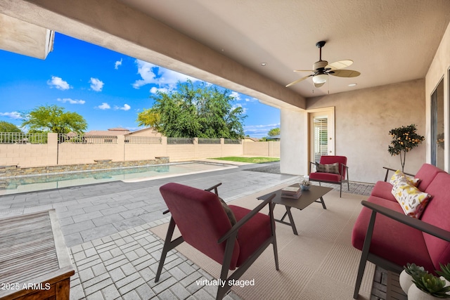 2565 N 141st Ln, Goodyear, AZ 85395 - view of patio / terrace featuring ceiling fan, a fenced backyard, and an outdoor hangout area