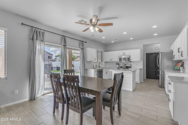 dining area with recessed lighting, visible vents, wood finish floors, and a ceiling fan