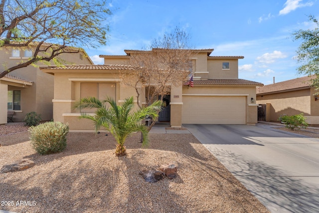 mediterranean / spanish-style house featuring concrete driveway, a tiled roof, an attached garage, and stucco siding