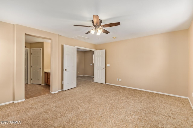 unfurnished bedroom featuring visible vents, light colored carpet, baseboards, and ceiling fan