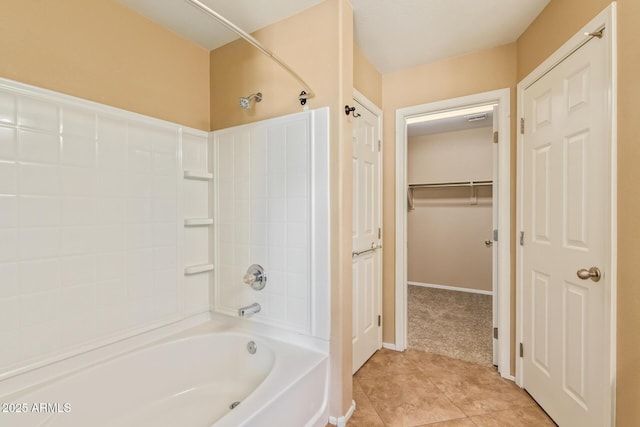 bathroom featuring shower / tub combination, baseboards, and tile patterned floors