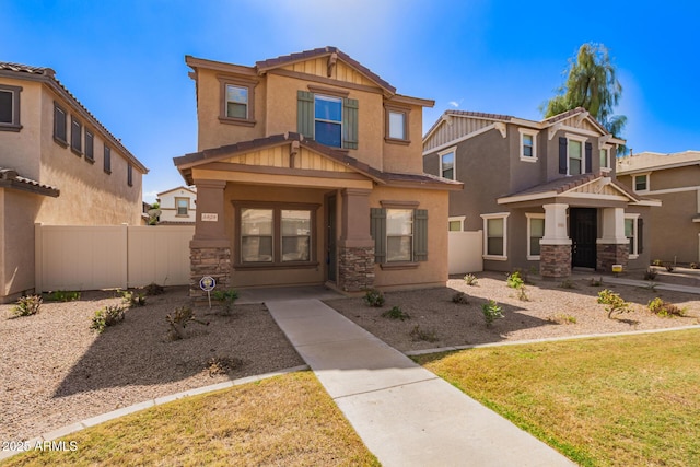 craftsman-style house featuring stucco siding, stone siding, a residential view, and fence