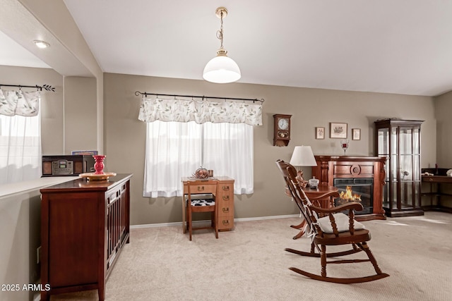 living area featuring light colored carpet and plenty of natural light