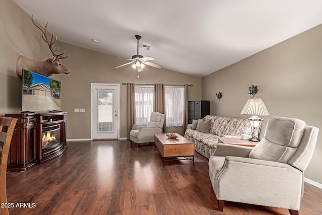 living room with vaulted ceiling, ceiling fan, and dark hardwood / wood-style floors