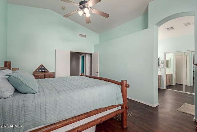 bedroom with vaulted ceiling, a closet, ceiling fan, and dark hardwood / wood-style flooring