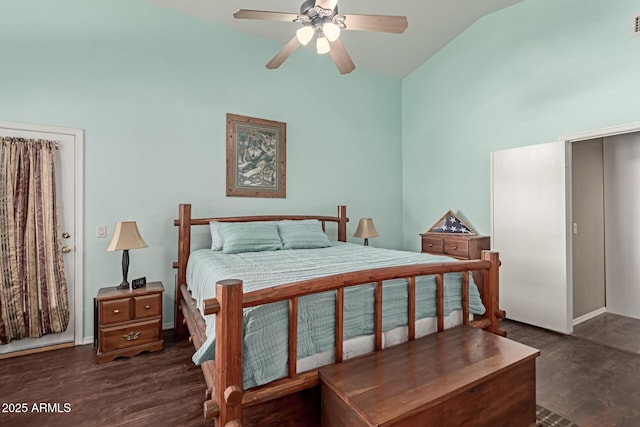 bedroom featuring dark hardwood / wood-style flooring, ceiling fan, and vaulted ceiling