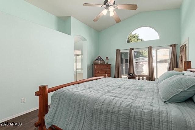 bedroom with ceiling fan, vaulted ceiling, and dark hardwood / wood-style floors