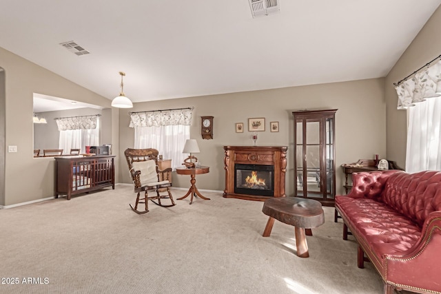 living room with lofted ceiling and carpet