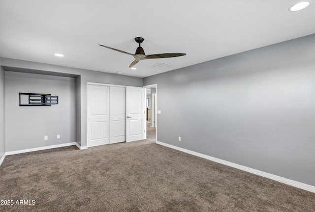 unfurnished bedroom featuring carpet flooring, a closet, and ceiling fan