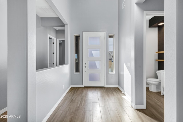 foyer entrance with light hardwood / wood-style flooring