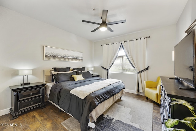 bedroom featuring ceiling fan, baseboards, and dark wood-style flooring