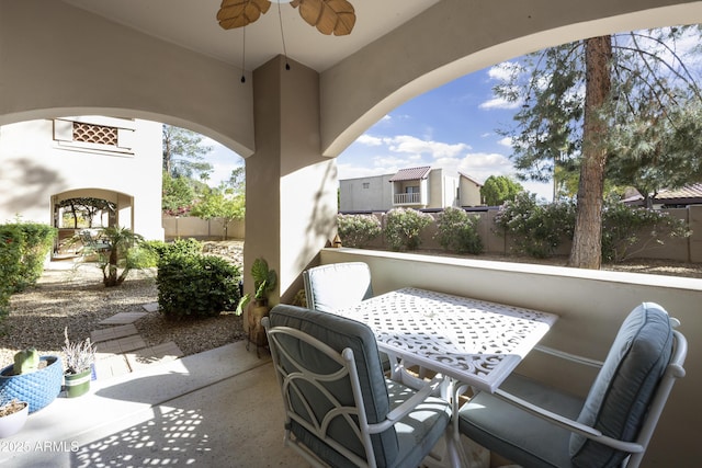 view of patio / terrace featuring outdoor dining space, a ceiling fan, and fence