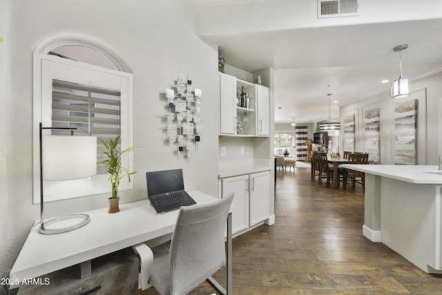 dining space with recessed lighting, visible vents, and dark wood-type flooring