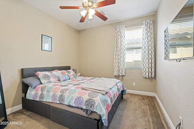 bedroom with a ceiling fan, visible vents, baseboards, and carpet flooring