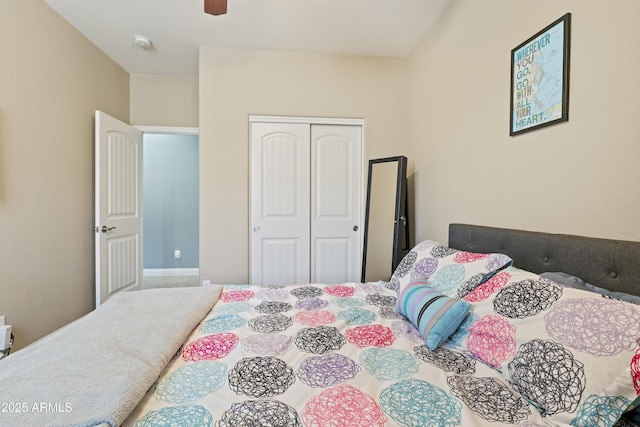 bedroom with ceiling fan and a closet