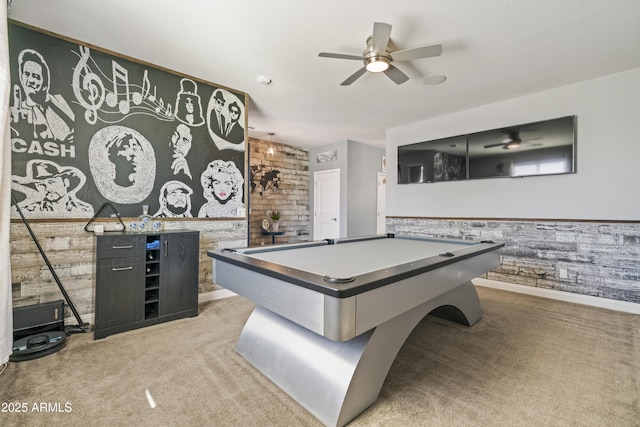 game room featuring a ceiling fan, light colored carpet, a wainscoted wall, and billiards