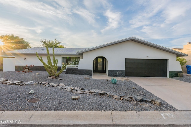 ranch-style home featuring a garage