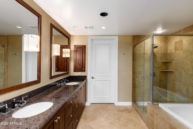 bathroom with shower with separate bathtub and vanity