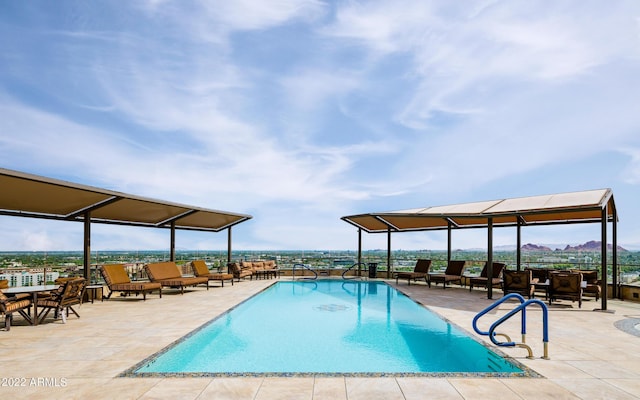 view of swimming pool featuring a patio area