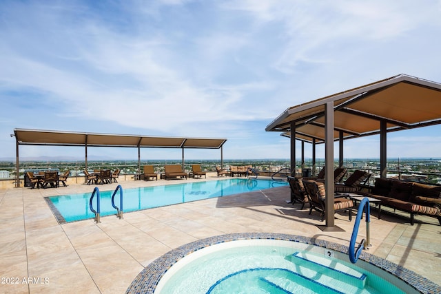 view of pool with a patio and a community hot tub