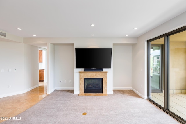 unfurnished living room with light carpet