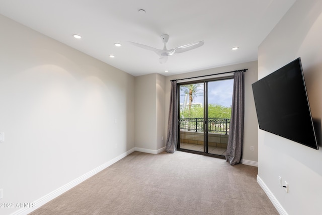 interior space featuring ceiling fan and light colored carpet