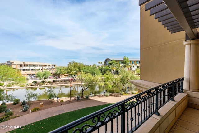 balcony featuring a water view