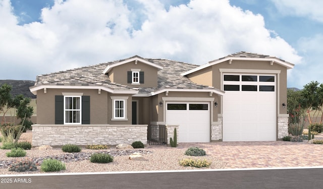 18195 W Ashley Dr, Goodyear, AZ 85338 - view of front of home with stucco siding, stone siding, a garage, and driveway
