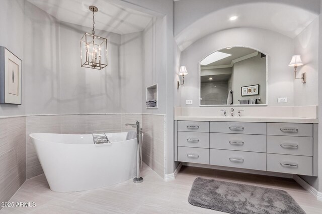 bathroom featuring vanity and a bathing tub