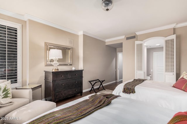 bedroom featuring crown molding and hardwood / wood-style flooring