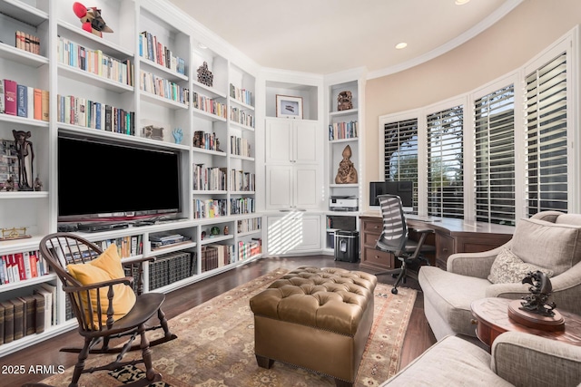 living area with crown molding and dark hardwood / wood-style floors