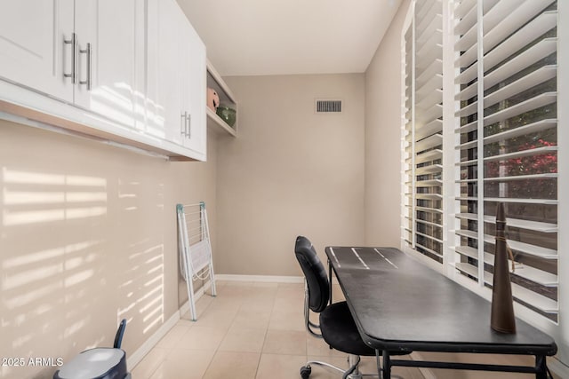 office space with light tile patterned floors