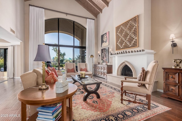 living room with high vaulted ceiling and dark hardwood / wood-style floors