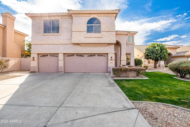 mediterranean / spanish-style home featuring a garage and a front yard