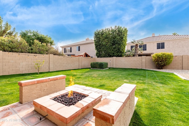 view of yard featuring a patio and an outdoor fire pit