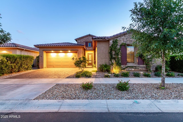 5328 S Wesley Cir, Mesa, AZ 85212 - view of front of house featuring a tile roof, stucco siding, driveway, an attached garage, and stone siding