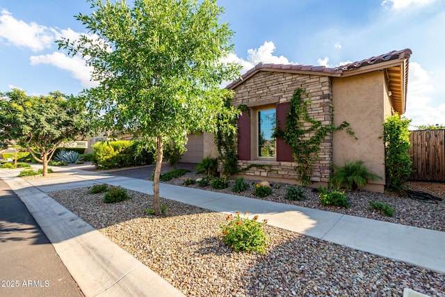 5328 S Wesley Cir, Mesa, AZ 85212 - view of front of home featuring stone siding, driveway, stucco siding, a tile roof, and a garage
