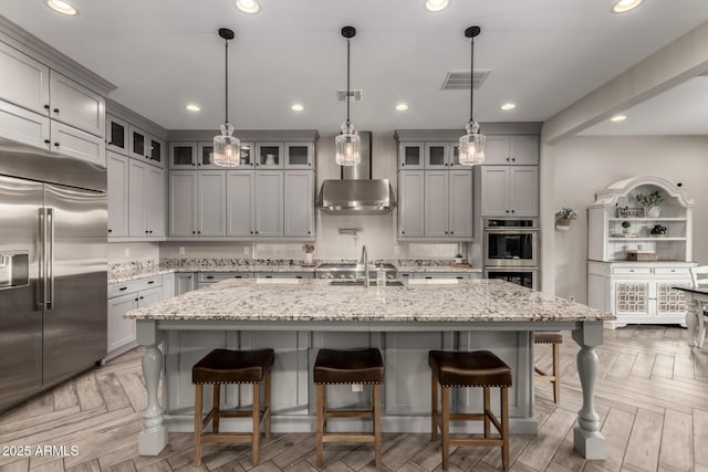 5328 S Wesley Cir, Mesa, AZ 85212 - kitchen featuring appliances with stainless steel finishes, gray cabinets, a sink, a kitchen breakfast bar, and recessed lighting