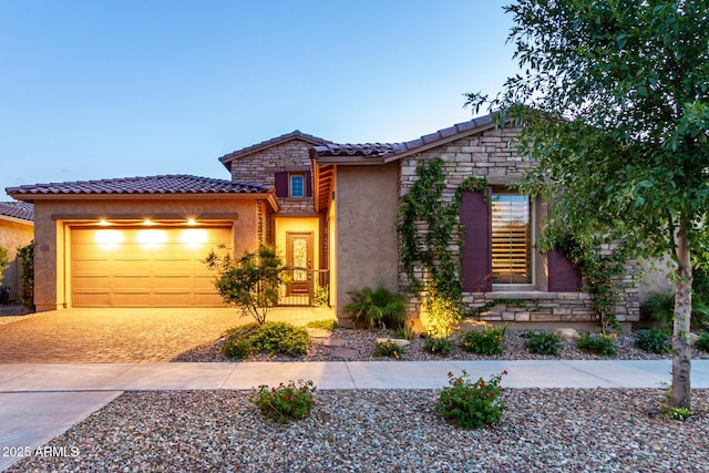 5328 S Wesley Cir, Mesa, AZ 85212 - view of front of home featuring a tiled roof, an attached garage, decorative driveway, stucco siding, and stone siding