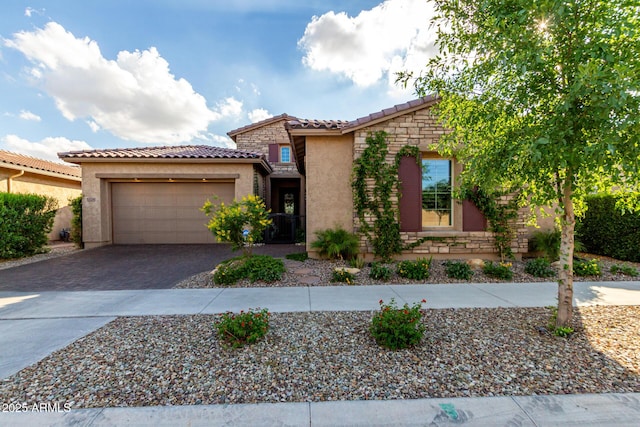 5328 S Wesley Cir, Mesa, AZ 85212 - view of front of home featuring a tiled roof, driveway, stucco siding, and stone siding