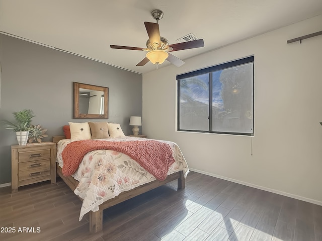 bedroom featuring ceiling fan and dark hardwood / wood-style floors