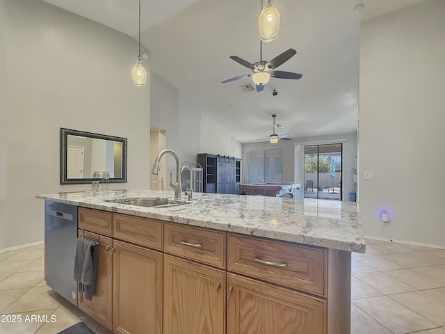 kitchen featuring sink, dishwashing machine, light tile patterned floors, and lofted ceiling