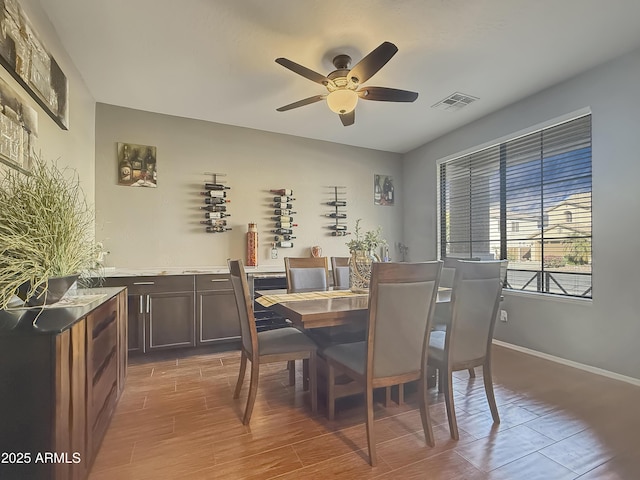 dining space with ceiling fan