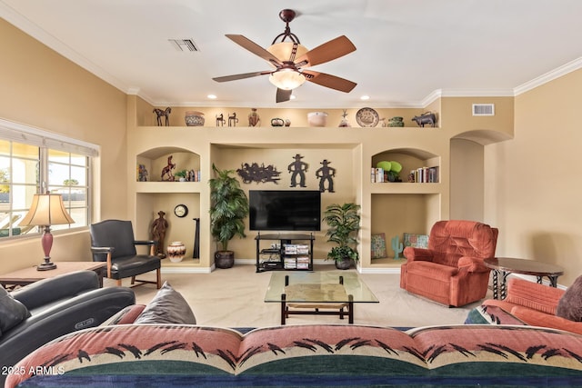 living room featuring crown molding, carpet, visible vents, and built in features