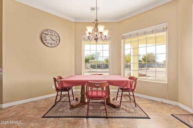 dining space featuring an inviting chandelier, baseboards, visible vents, and crown molding